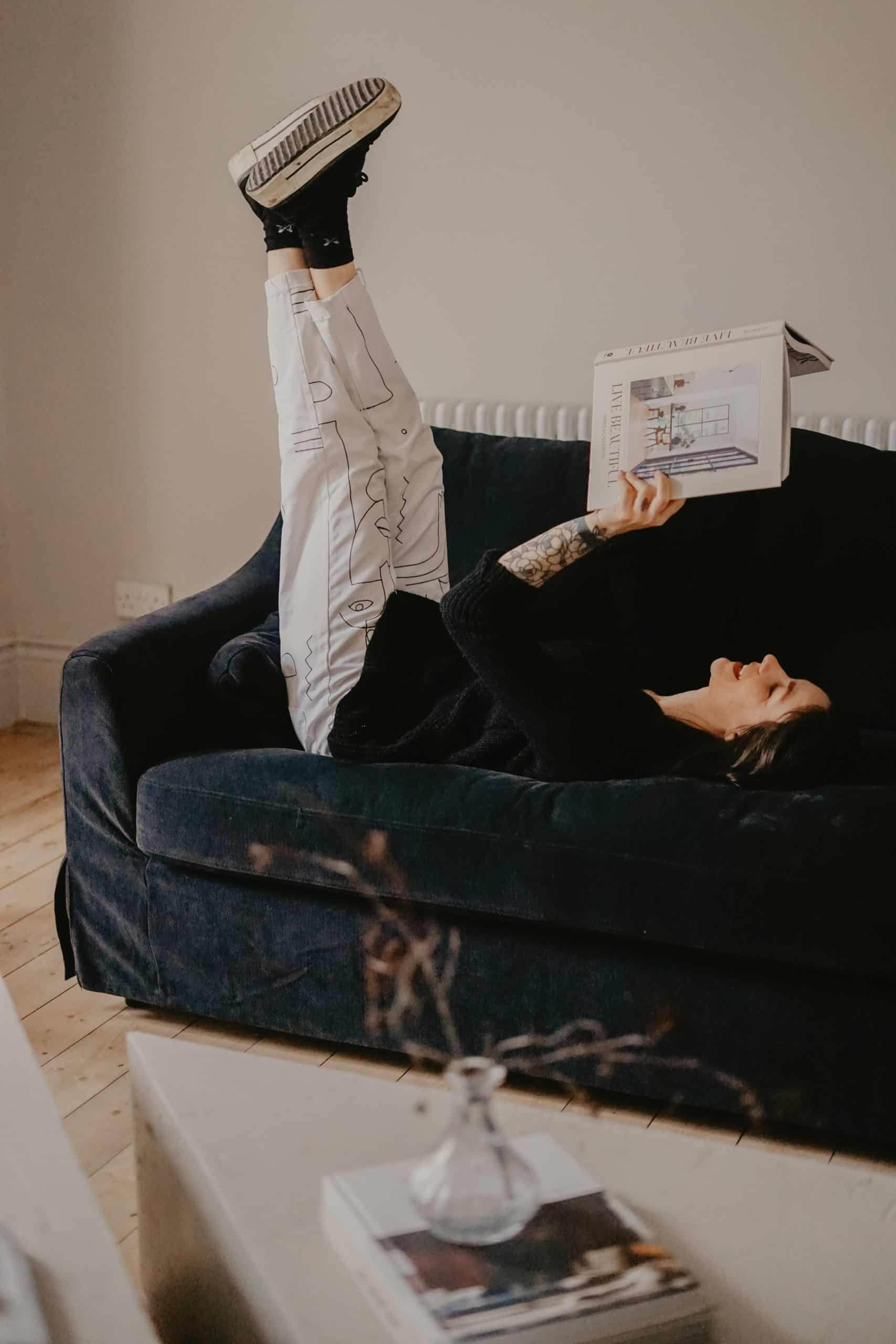 Young girl reading a book which is a good habit for personal growth.