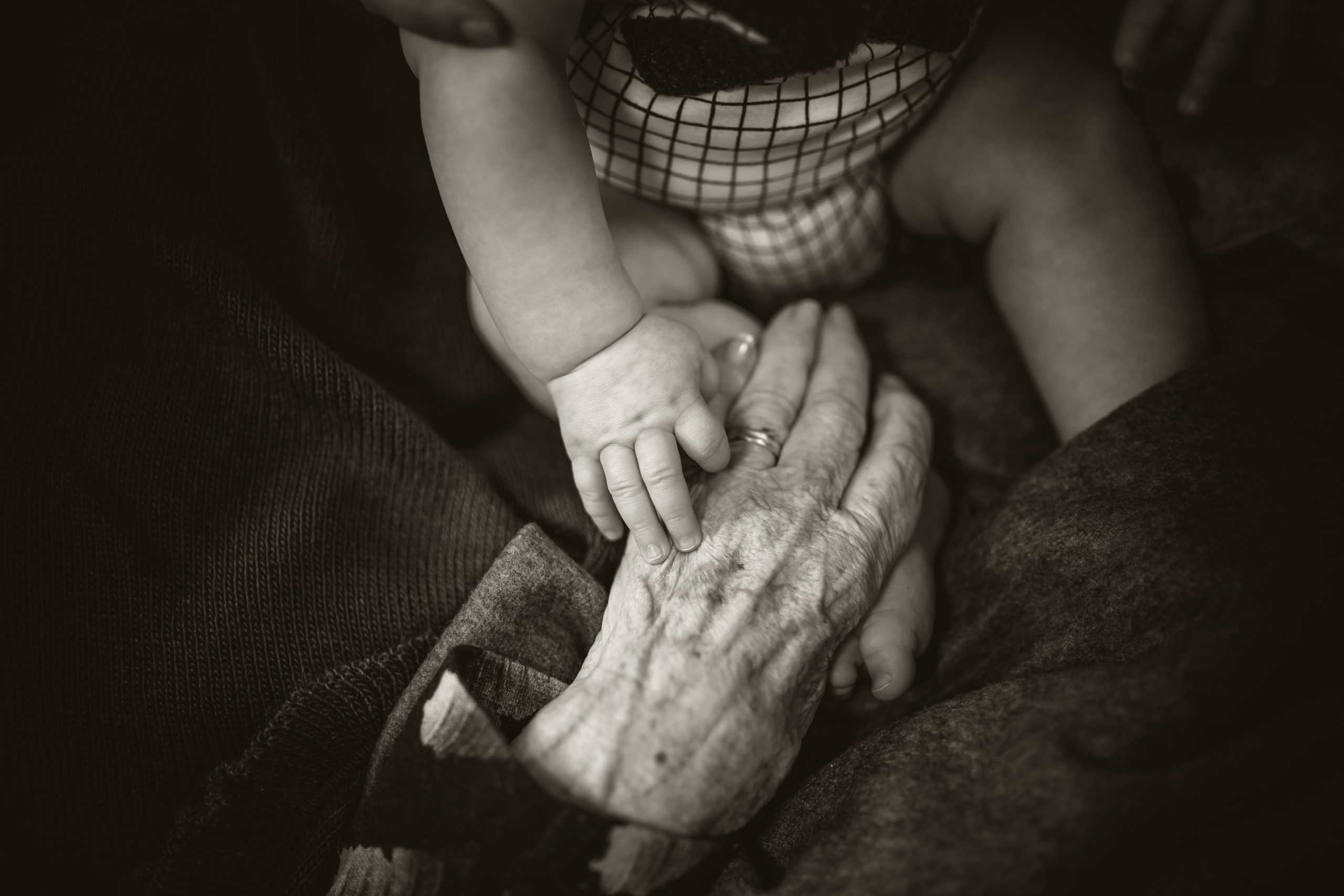 An old woman with a child holding hands emphasizing the fact that OCD does not go away with age.