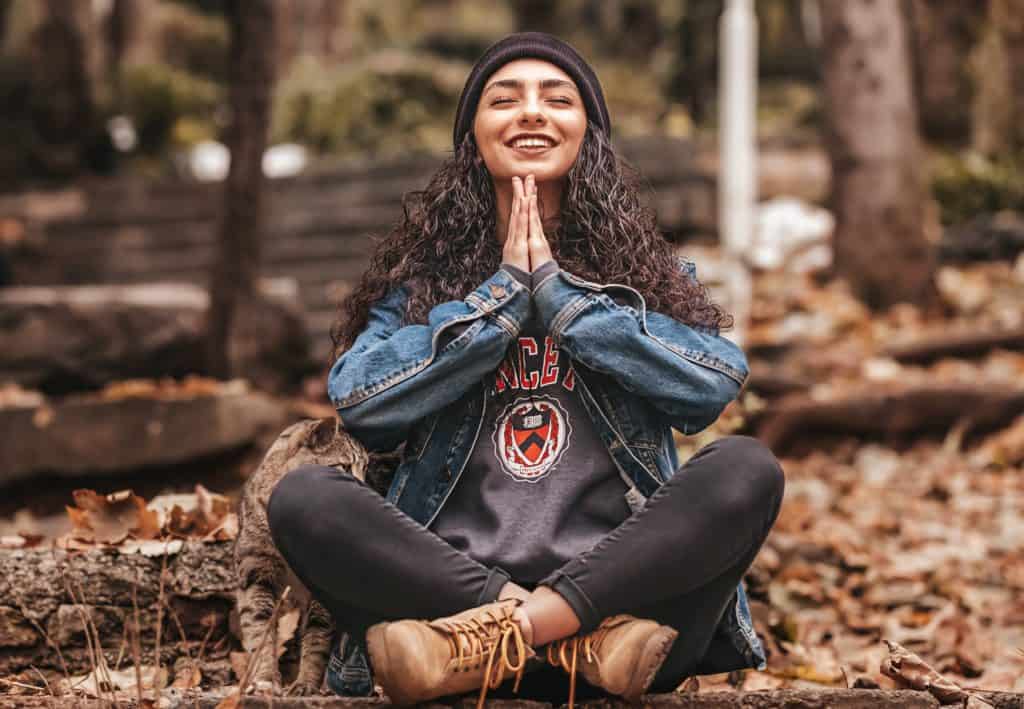 A girl indulging in meditation in hopes of achieving spiritual growth