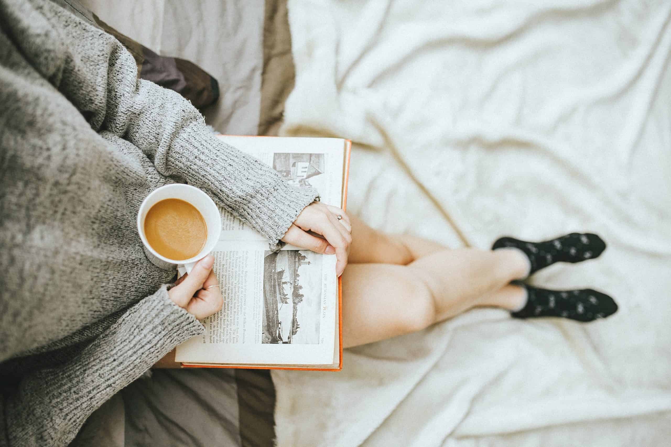 Woman reading which is an example of weekly things to do for self development