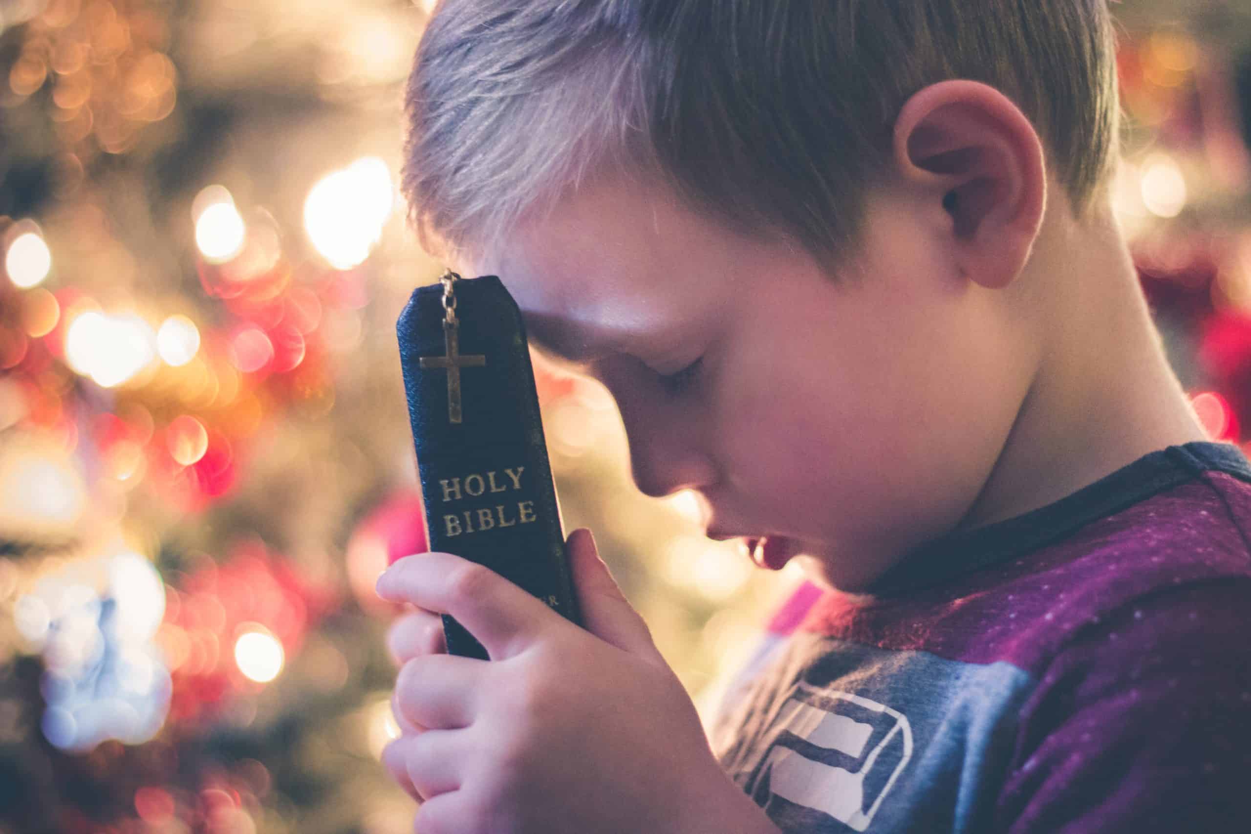 Kid with a bible after having experienced Religious ocd