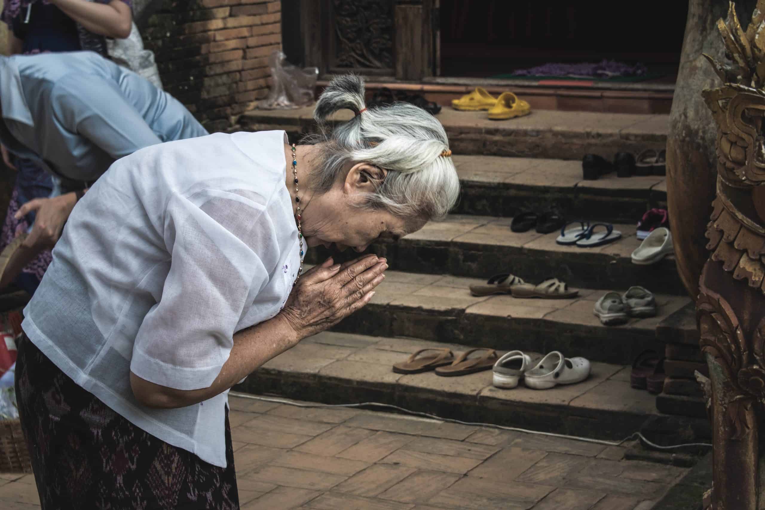 Praying woman after experiencing Scrupulosity OCD