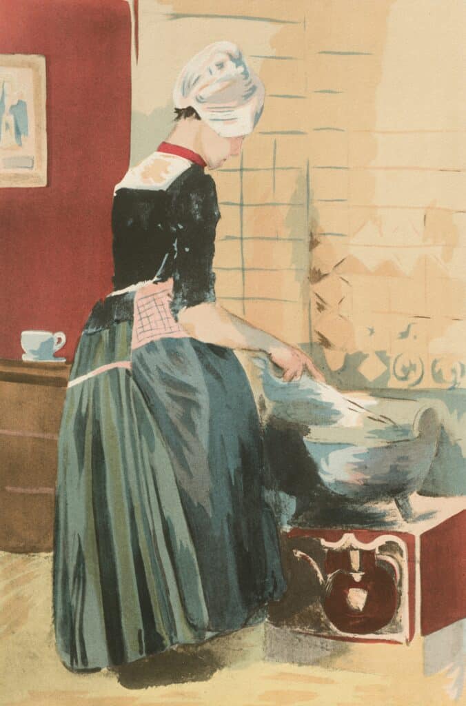 A woman cooking in a kitchen.